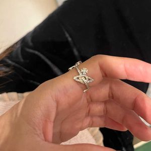 Merk van hoge kwaliteit Westwoods volledige diamant diagonaal set drie saturn ringen prachtig met holle vliegtuig planeet wijs vinger ring nagel