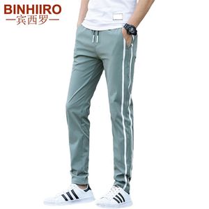 Merk heren casual broek dunne sectie mode ademende gestreepte broek streetwear slanke lente en zomer casual broek mannen 201126