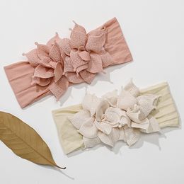 Gloednieuwe bloem nylon baby hoofdband meisjes bloemen nylon hoofdband kinderen haaraccessoires peuter zachte kopteksel