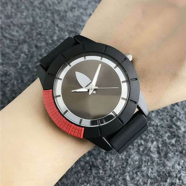 Montres à quartz de marque pour femmes hommes unisexe avec cadran de style trèfle à 3 feuilles bande de silicone AD20