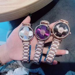 Marke Uhren Frauen Mädchen Aushöhlen Blume Stil Stahl Metall Band Quarz Armbanduhr L103026