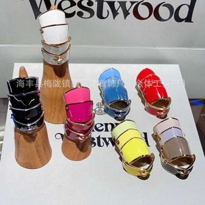 Merk Westwoods kleurrijk gelakte vier sectie pantser saturn ring punk stijl driedimensionaal planeet paar nagel