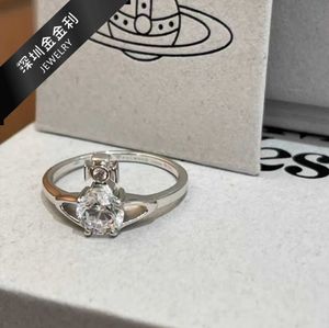 Merk Westwoods licht luxe zoete volledige diamant reina vier claw zirkon saturn ring pistool zwart paarse nagel