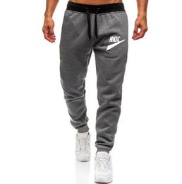 Ademende elastische broek heup pop slanke casual broek bodems lopende sportschool joggingpants mannen joggers fitness sportmerk logo print