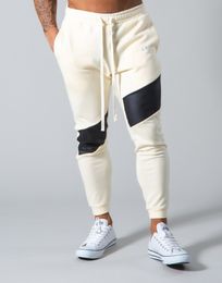 Pantalones de calle transpirables para hombres Gimnasios de diseño Pantalones de chándal negros Joggers Hombres flacos Pantalones casuales Hombre Fiess Entrenamiento Pantalones de chándal de algodón Otoño Invierno Ropa deportiva