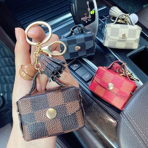 Porte-clés à carreaux marron, anneaux en cuir PU, pompon sans fil, étui pour casque Bluetooth, porte-clés de voiture, mignon sac Cion, pendentif, breloques, bijoux à la mode