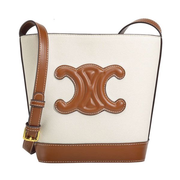 Sac seau sac messager designer cel Toile seau en croûte de cuir La peau de vache a une belle capacité Hong Kong Arc de Triomphe Cuir Simple Sac Seau pour Femme Z TC03