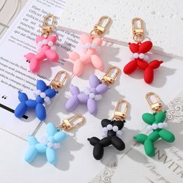 Prix en gros perle ballon chien porte-clés pendentif en plastique résine mignon dessin animé poupée sac porte-clés bijoux accessoires cadeau