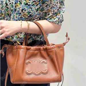 CABAS Petit sac fourre-tout à cordon Sac de créateur Sacs à main de luxe Femme Totes Sac à bandoulière Cuir Le sac fourre-tout Bandoulière longue détachable