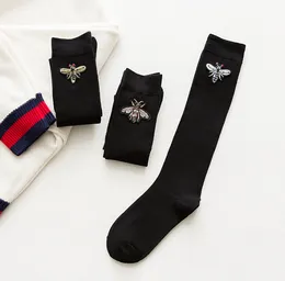 Chaussettes de mollet pour femmes, uniforme Lolita noir, chaussettes JK japonaises, bas mi-longs d'automne et d'hiver, chaussettes hautes mignonnes de Style Preppy
