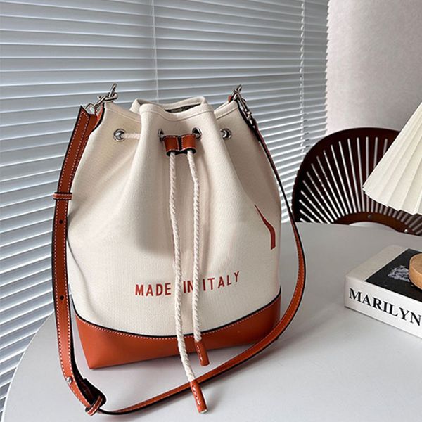 Bolso de lona con forma de cubo, bolso de diseñador, bolso de hombro informal con cordón, bolso de viaje de fin de semana, herrajes plateados, letras bordadas, bolso con correa de cuero extraíble