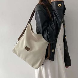 Bolso de lona para mujer, nueva mochila minimalista de estilo universitario de alta capacidad, bolso de hombro informal moderno y versátil
