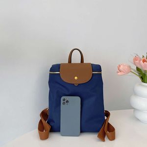 Capacité bouton couleurs contrastées fermeture éclair moraillon tissu décontracté sacs à dos offre spéciale polyvalent femmes sac Mochila Mujer