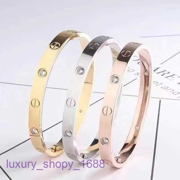 Neumáticos de coche Pulseras de diseño para mujeres y hombres Moda Pareja Luz de lujo Joyería de mano de acero inoxidable Diez pulsera de titanio con diamantes con caja original 51M0