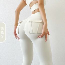 Vrachtwind fitness broek vrouwen met pocket sport leggings strekken hoge taille perzik heup yogabroek lange broek om 240420 te dragen