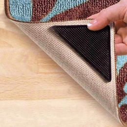Tapijten 4 stks/set thuis vloer tapijt tapijtmat grijpt grijpen zelfklevende anti-slip driehoek wasbare herbruikbare zwarte siliconen plakblokken grepen