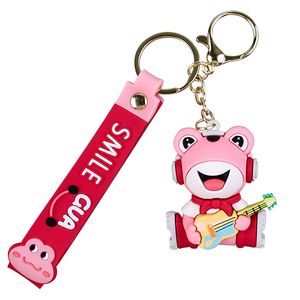 Dessin animé mignon musique grenouille poupée porte-clés jouant de la guitare grenouille solitaire simple voiture sac d'école ornement pendentif porte-clés porte-clés HW0129