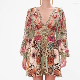 Casual jurken 2024 Spring vakantie vrouwen bloemenjurk boren printen diep v-hals lantaarn lange mouw tuniek short fit flare