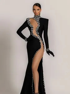 Casual jurken 2024 vrouwen sexy lange mouw uitgesneden kristal zwart gesplitste trompet maxi elegante verjaardag avondfeestjurk