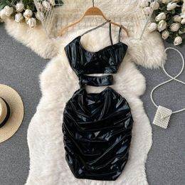 Robes décontractées Europe et États-Unis Design Sense Shiny Hollow Backless Bralette Hanging Neck Package Hip Sexy Girl Dress