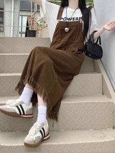 Robes décontractées Style coréen Femmes Denim Robe globale Automne Chic Sans manches Poches A-ligne Sangle Robes Longues Gland Dames Jean