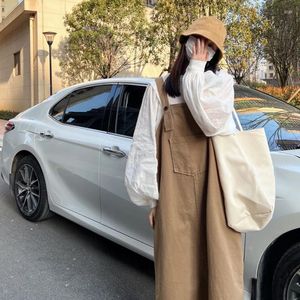 Vestidos casuales de primavera para mujer, falda larga con tirantes sueltos, camisa de manga a la moda para mujer, conjunto de dos piezas sólido de calle alta coreana