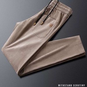 Casual broek, herenmodetrend, lentelegging, Koreaanse versie, effen kleur Harun-broek, minimalistische strips voor heren