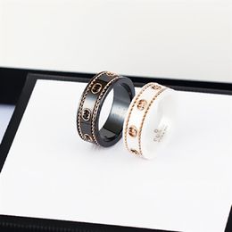 Keramische bandring dubbele letter sieraden voor dames heren zwart en wit goud bilaterale holle G-ringen mode online beroemdheid coup256W