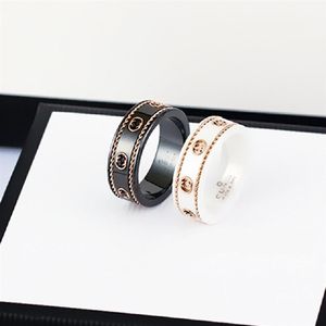 Keramische bandring dubbele letter sieraden voor dames heren zwart en wit goud bilaterale holle G-ringen mode online beroemdheid coup326e
