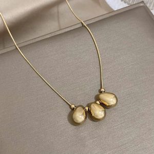 Chaînes Dodohao 316L en acier inoxydable couleur or creux perles de goutte d'eau pendentif collier pour femmes simples bijoux de cou de cou sans décoloration