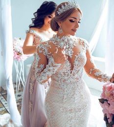 Champagne Arabe Dubaï Nouvelles Robes De Mariée Sirène Col Haut Illusion Manches Longues En Dentelle Appliques Perles De Cristal Bouton Retour Robes De Mariée