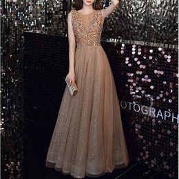 Champagne Gold Prom-jurken Illusie O-Neck A-Line lovertjes lovertjes kralen mouwloze glanzende luxe gasten avond Women bruidsmeisjes jurken 2023