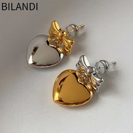 Charme Bilandi 925 Argent Aiguille Asymétrique Lisse En Métal Bowknot Coeur Boucles D'oreilles Pour Les Femmes Bijoux Sens Senior Doux Conception Coréenne 231208