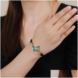 Bracelets de charme 19 Color Simple Hip Hop Crystal Butterfly Black Leather Rope Bracelet Classic en acier inoxydable fermoir magnétique bijoux dhk8x