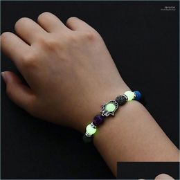 Bracelets de charme Bracelets de charme 2022 Pierre volcanique naturelle brillante dans le noir Hamsa main hommes femme bracelet de fête lumineux plage J Dhnwt