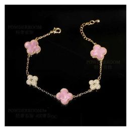 Pulseras con dijes Pulsera de trébol Brazalete Joyería Placa rosa Hierba de cuatro hojas Micro incrustado con circón Pequeño Fresco Dulce y encantador Estilo de lujo para mujer Lu Dh5Od