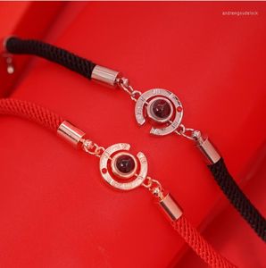 Pulseras de encanto Lucky Red Pulsera de cuerda hecha a mano para mujeres Hombres Moda Amante romántico Pareja 100 Idioma Te amo Regalos de proyección