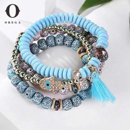 Bracelets de charme Obega 4pcs Set Great Bracelet Bracelet élastique Perles de couleur or Tassel Turquoise Option acrylique