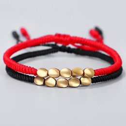 Bracelets porte-bonheur conception créative épaisse perles de cuivre irrégulières rouge noir corde tirant Bracelet pour femmes hommes nœuds faits à la main fil