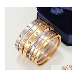 Pulseras con dijes Amantes de las mujeres Pulsera Sier Brazaletes de oro Hombres Luxurydesigner Joyería Titanio Acero Pareja Moda simple Sin perno Driv DH3JB