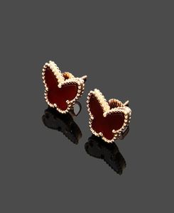 Charm designer fleur à quatre feuilles or 18 carats oeil de tigre pierre VC lettres mini papillon boucles d'oreilles mini coquillages colorés luxe j3636134