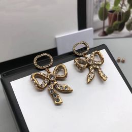 Créateur de boucles d'oreilles à breloques pour femmes nouveau pendentif noeud papillon vintage créateurs de marque de luxe de mode sobre 2022 fête à la maison bijoux pop de haute qualité avec boîte et timbre