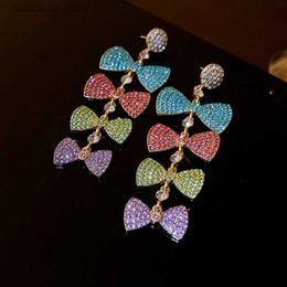 Charme incrusté de strass coloré arc gland boucles d'oreilles pour les femmes exagérées étincelle goutte boucle d'oreille personnalité bijoux de fête de mariage Y240328