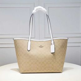 Monederos baratos a la venta 2023 Olay nuevo bolso de mujer bolso de mano de doble cara moda versátil clásico flor vieja mamá compras