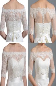 Pas cher blanc ivoire dentelle vestes de mariée boléros épaule demi manches boutons couverts mariage mariée enveloppes haussement d'épaules pour robe de mariée6904106