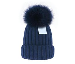 Gorro entero barato Nuevos gorros de invierno Gorros de punto Gorros de mujer Gorros gruesos con pompones de piel de mapache real Gorros cálidos para niñas pomp75024795237