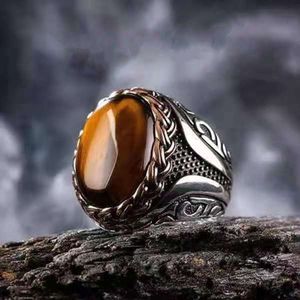 Chenruichang verkoopt high-end mode Geel Tiger Stone gestreepte ringen en trendy heren