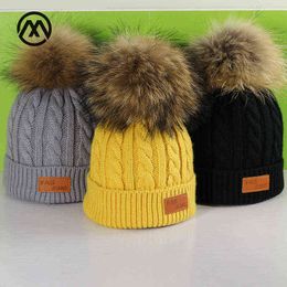 Hiver pour enfants nouveaux chapeaux en tricot boule de cheveux en cuir de raton laveur chaud confortable garçon fille pompons casquettes lâches épaississement bonnet slouchy Y21111