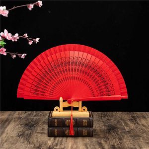 Produits de style chinois Fan pliant en bois espagnol Pure Couleur creux ventilateur de danse fan de danse femelle cadeau maison décor de salon rouge