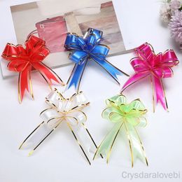 Décorations de Noël 100 / 200pcs Pull Bow Ruban Emballage cadeau Emballages de fleurs Dessinés à la main Flores en plastique Mariage Fête de Noël DIY Décoration festive 231006